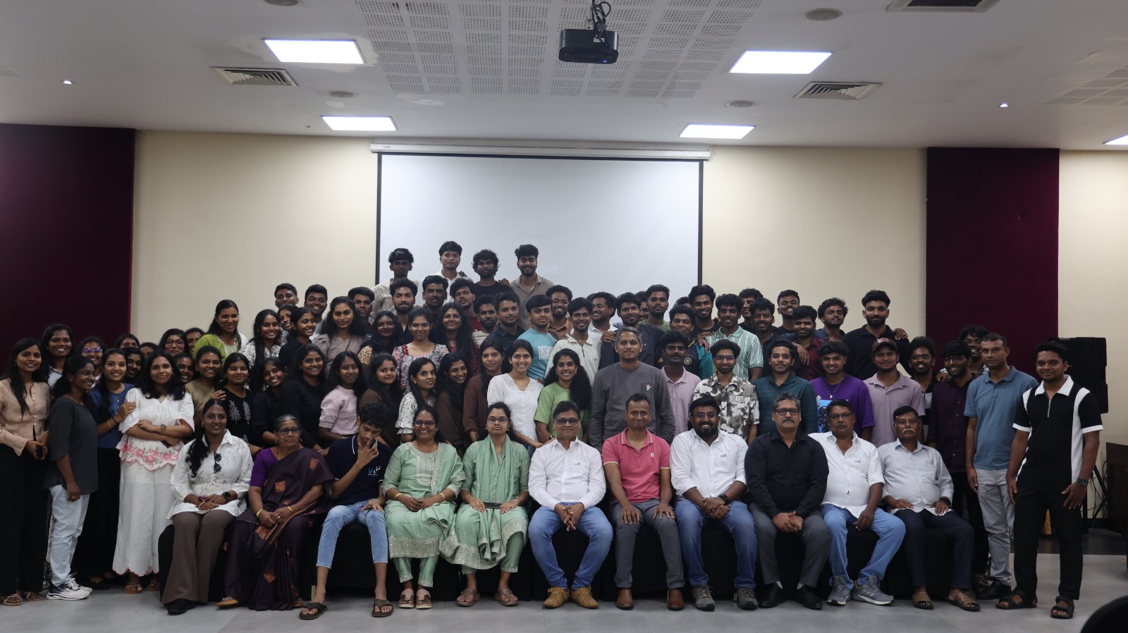 Unifi team gathered for a group photograph in the auditorium