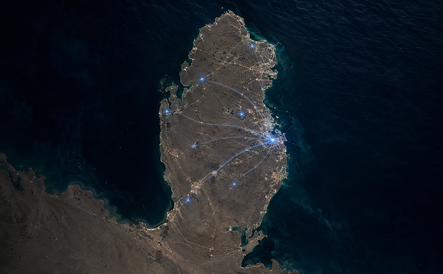 Satellite night view of the Qatar peninsula with a cluster of city lights